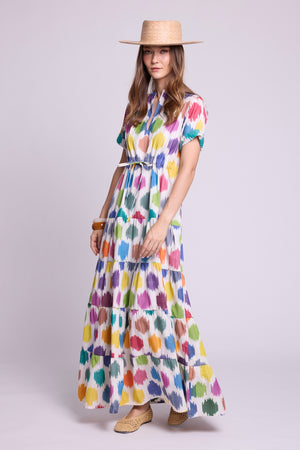 lookbook photo of model wearing kleed ikat cotton maxi dress with geometric motifs and a straw hat