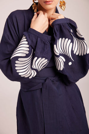 Close up of white floral hand embroidery on balloon sleeve cuffs of Kleed Blue Kandy Kimono in 100% cotton dark navy