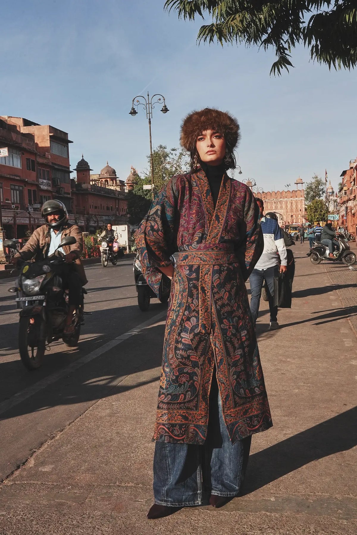 Kleed Fuchsia Paisley Kimono Coat in wool worn on the street with jeans and a brown leather tote, paisley print detail.