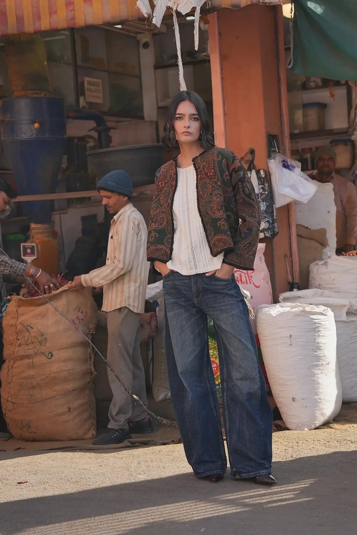 Kleed Green Oak Jacket in pure wool with paisley print in forest green and burgundy, styled with wide-leg jeans on the street.
