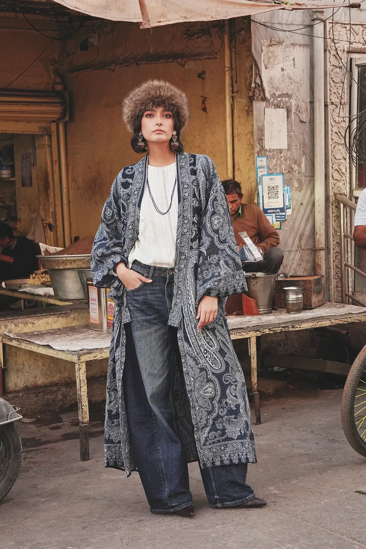 Kleed Blue Paisley Kimono Coat in wool styled with jeans and a brown leather tote, indigo paisley print detail.
