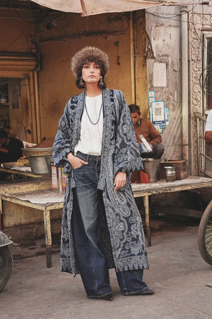 Kleed Blue Paisley Kimono Coat in wool styled with jeans and a brown leather tote, indigo paisley print detail.