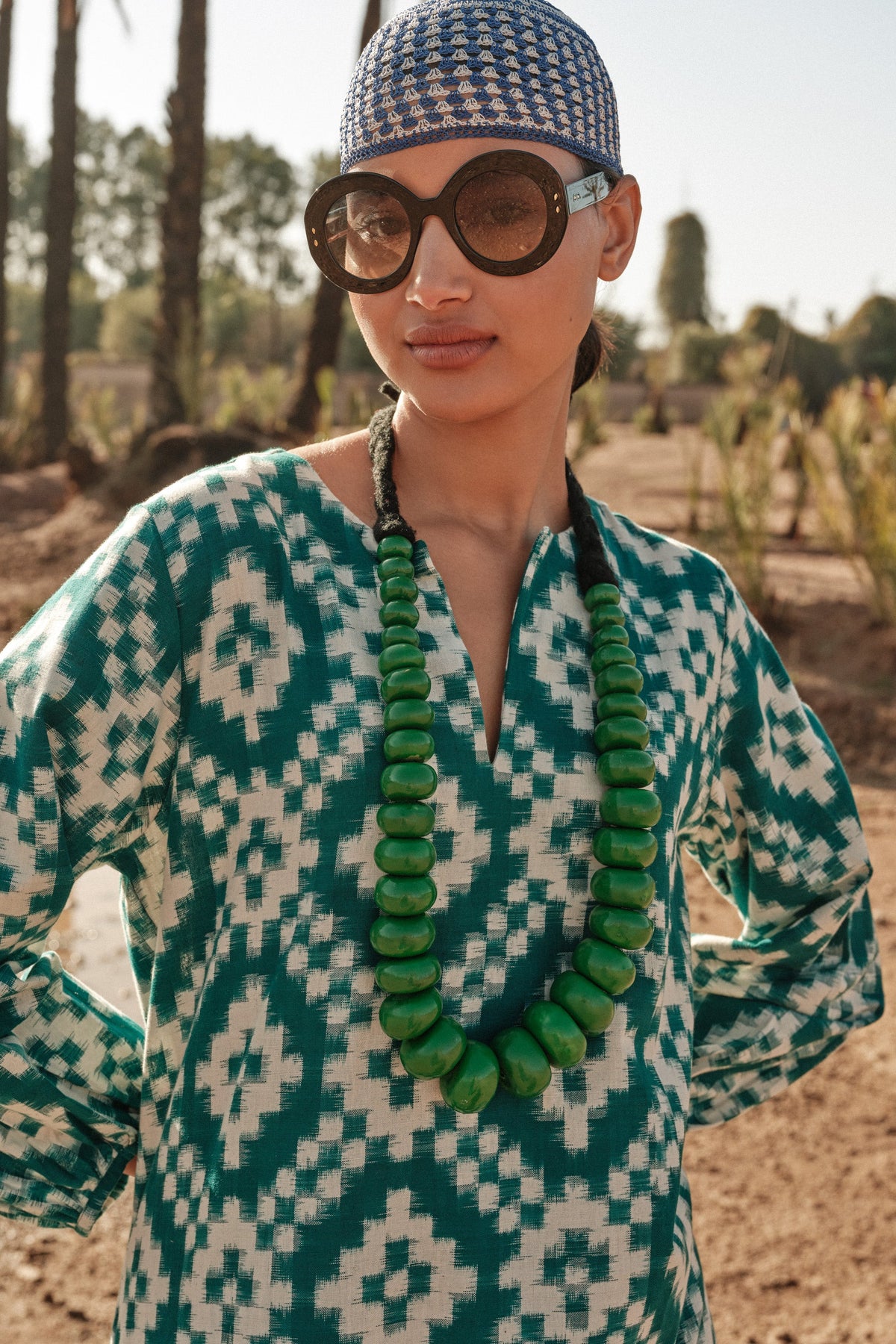 Kleed Dorcas Green Kaftan, a kaftan dress with green ikat pattern and hand embroidery