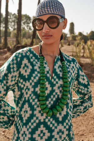 Kleed Dorcas Green Kaftan, a kaftan dress with green ikat pattern and hand embroidery