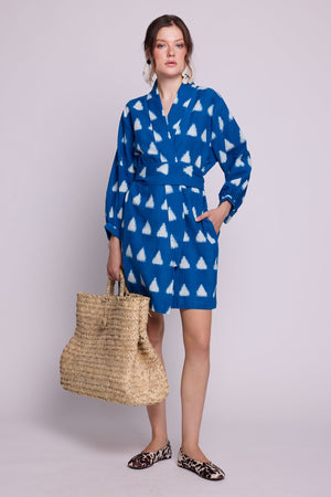 Back view of model wearing Kleed Turquoise Savannah Short Kimono in handwoven Ikat cotton, tied at the waist with matching belt.