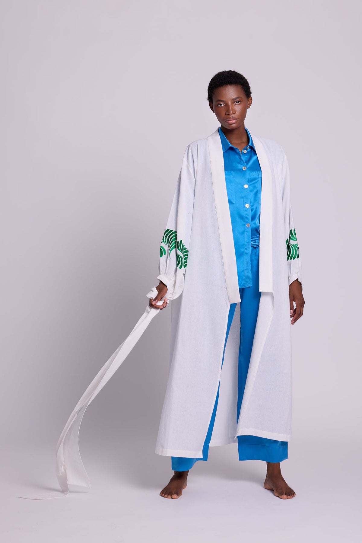 Kleed Light Kandy Kimono in 100% cotton with emerald green silk floral embroidery on balloon sleeve cuffs.
