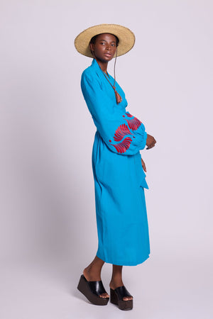 Side view of Kleed Sky Blue Kandy Kimono in 100% cotton with red embroidered cuffs and balloon sleeves.
