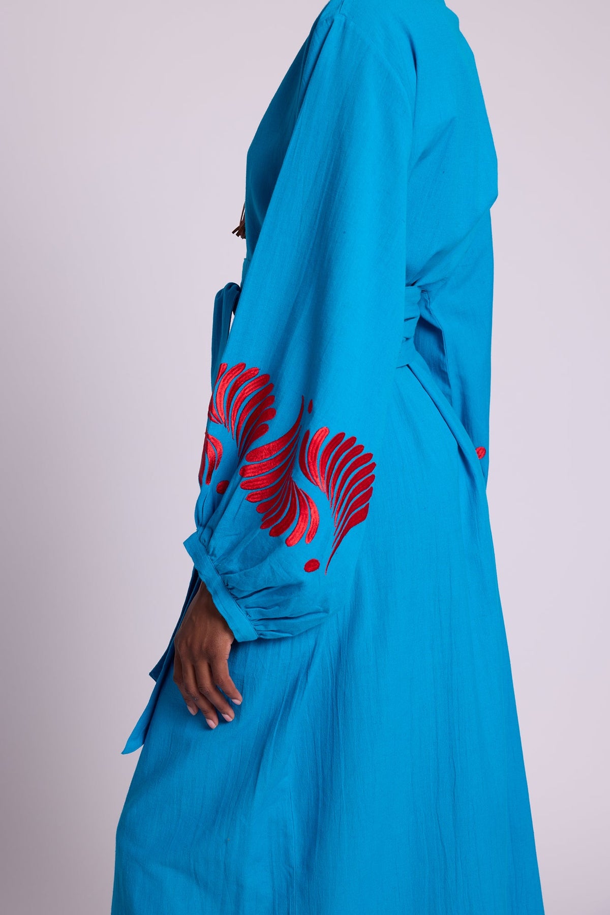 Detail of red silk floral embroidery on the balloon sleeve cuffs of Kleed Sky Blue Kandy Kimono.
