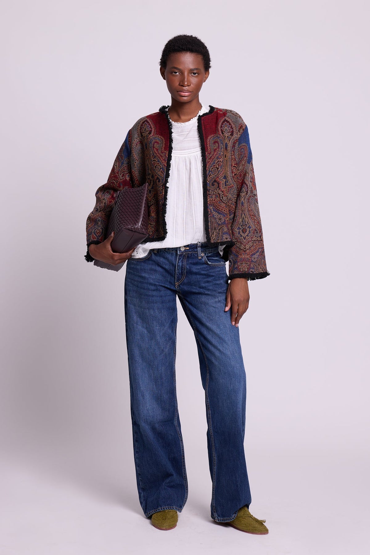 Full length view of Kleed Blue Oak Jacket in pure wool with indigo paisley print, styled with white top and wide-leg jeans.

