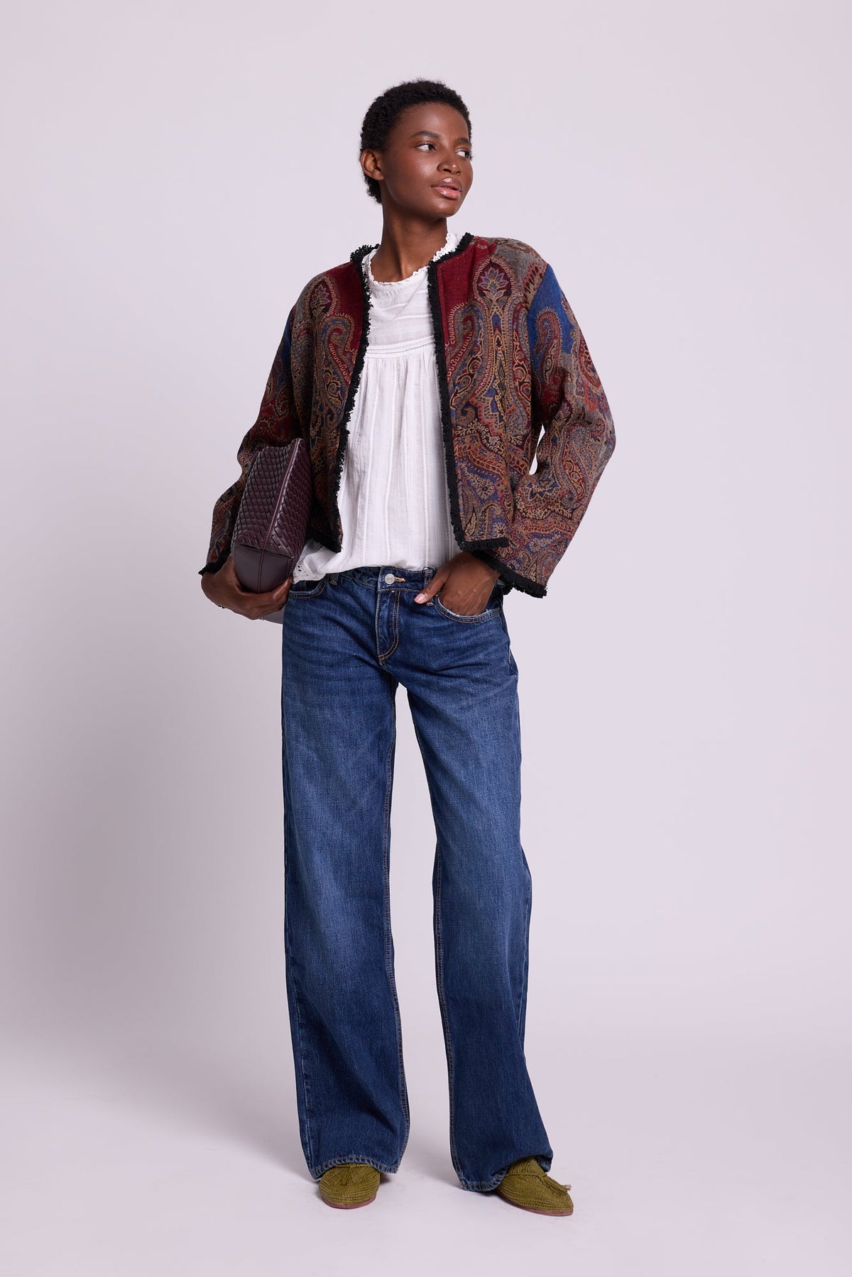 Front view of Kleed Blue Oak Jacket in wool with indigo paisley print, styled with white top and blue jeans.