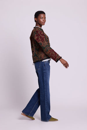 Side view of Kleed Green Oak Jacket in pure wool with paisley swirls and frayed edge detailing.
