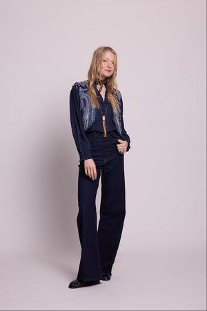 Full length front view of woman wearing the Kleed Blue Paisley Vest in navy wool with wide leg trousers
