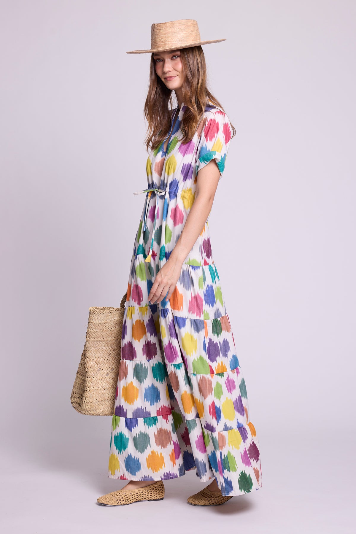 model wearing anouk maxi dress by kleed and a basket on her hand and a straw hat.  Dress is 100% cotton ikat hand loomed.