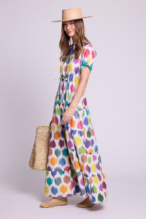 model wearing anouk maxi dress by kleed and a basket on her hand and a straw hat.  Dress is 100% cotton ikat hand loomed.