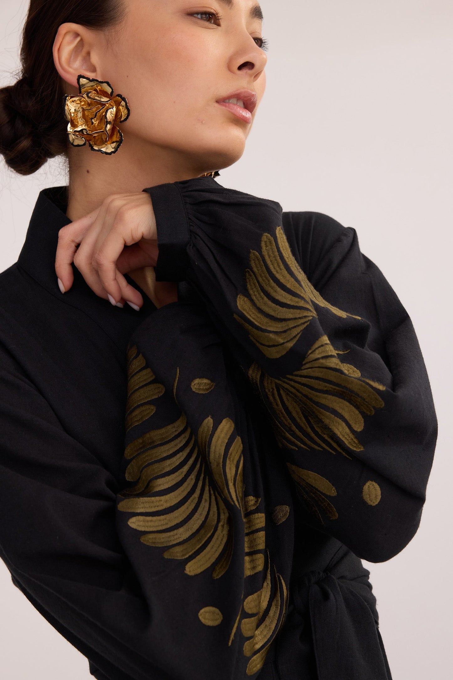 Close-up of Kandy Black Kimono by KLEED — 100% black cotton with gold khaki hand embroidered floral motif on sleeves