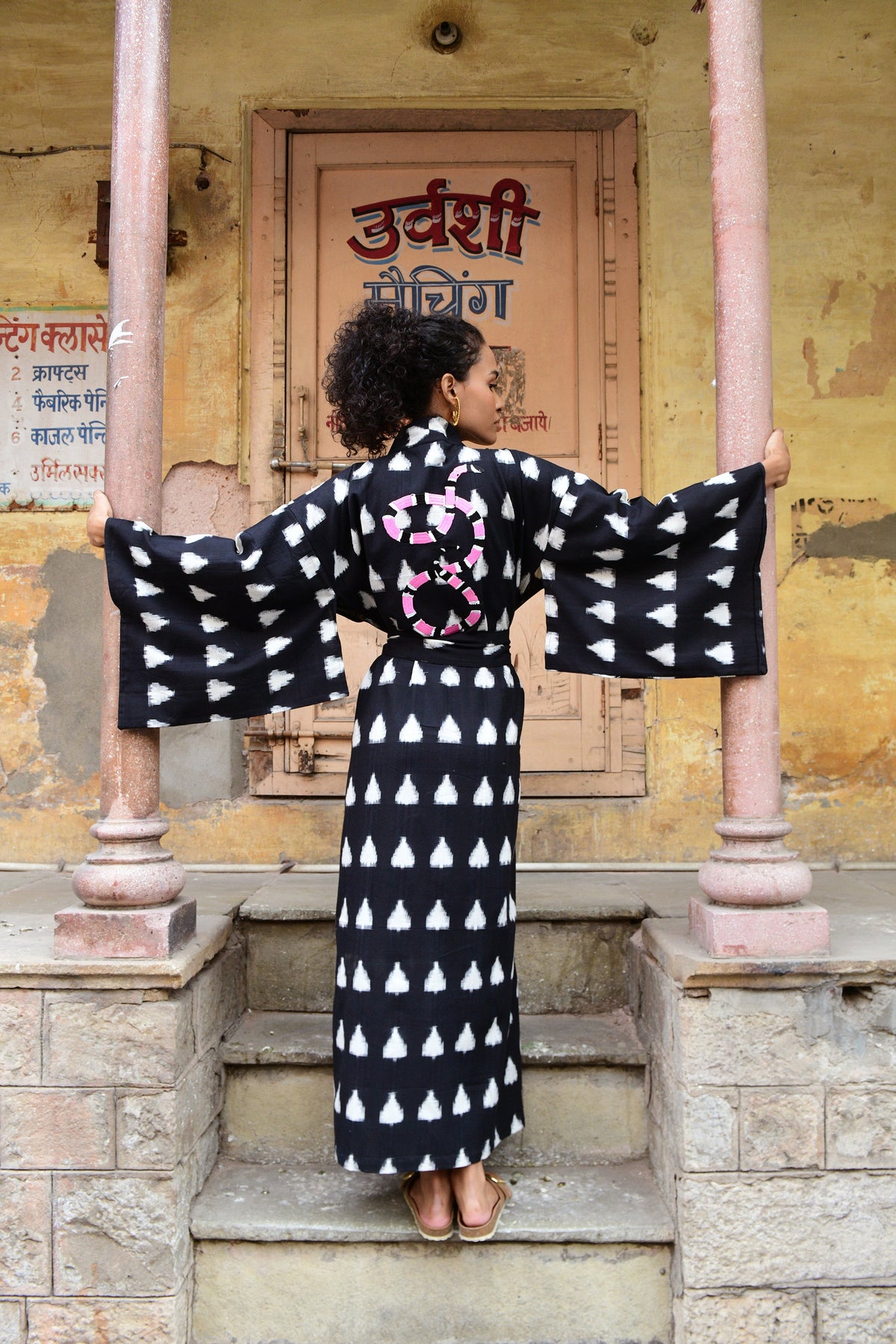 Model wearing a black Savannah handloomed Ikat kimono in 100% cotton editorial photo for summer 25 campaign 