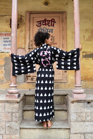 Model wearing a black Savannah handloomed Ikat kimono in 100% cotton editorial photo for summer 25 campaign 