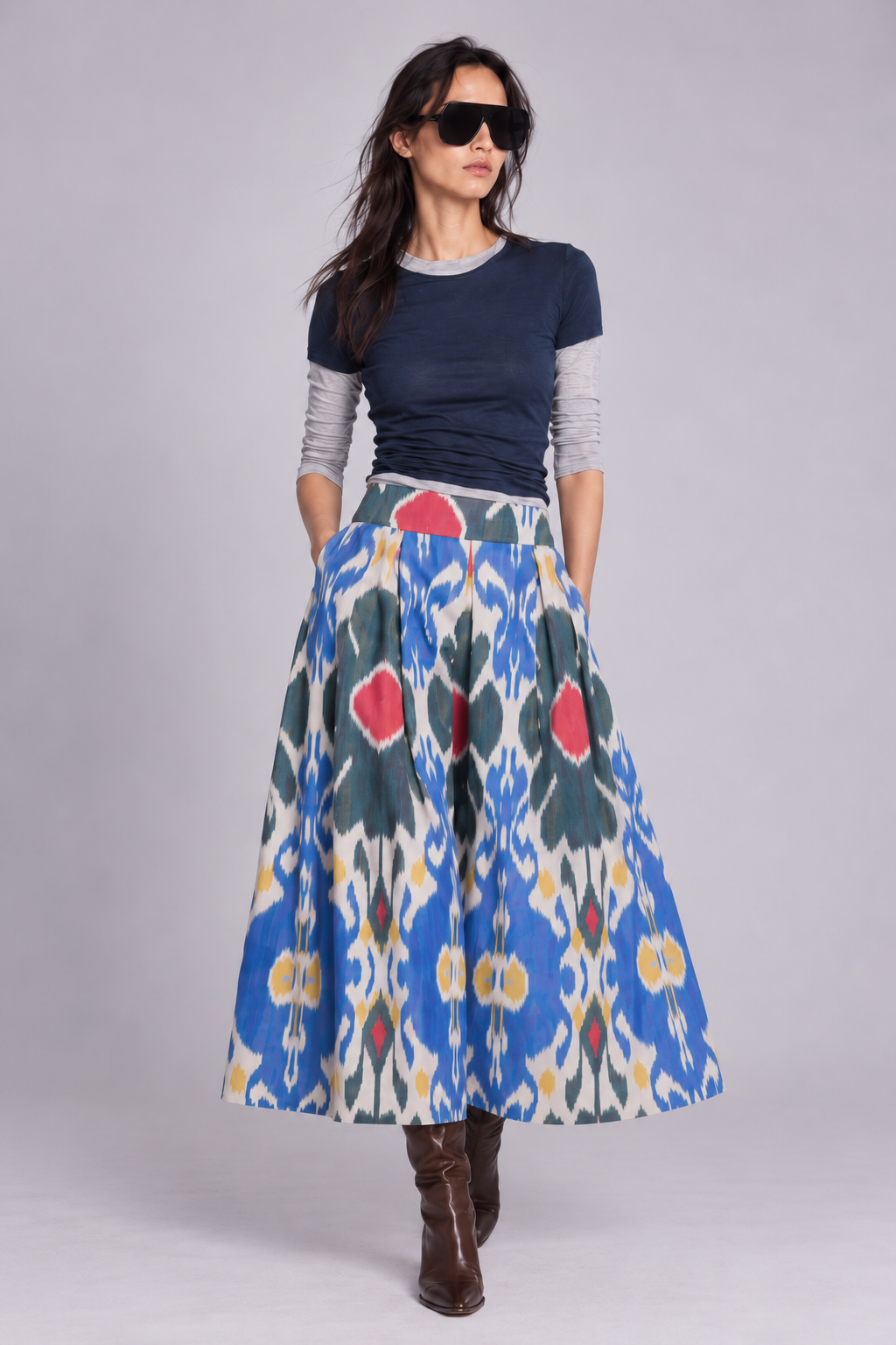 KLEED Garden Ikat Skirt, artisan-made women’s cotton skirt, hand-loomed in 100% cotton with pockets, styled with layered tops and burgundy boots.
