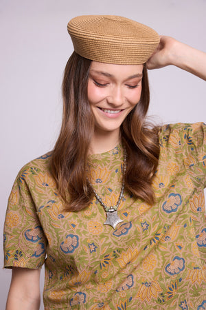 Close-up of Kaner Jasmine Pyjama by KLEED — hand block printed cotton fabric in olive, gold and blue floral