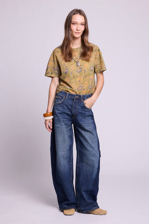 KLEED Kaner Jasmine Pyjama top — hand block printed cotton in olive green floral, styled with wide leg jeans