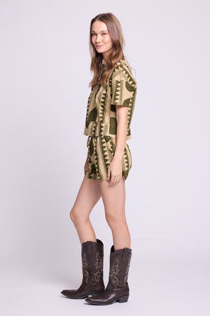 Side view of KLEED Kaner Khaki Geo Pyjama — sustainable cotton set with oversized circle geometric print