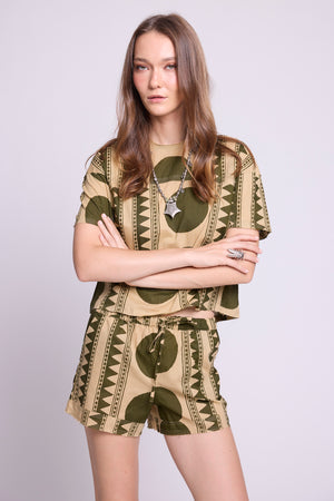 Close-up of KLEED' Kaner Khaki Geo Pyjama — 100% cotton with bold olive geometric and stripe print