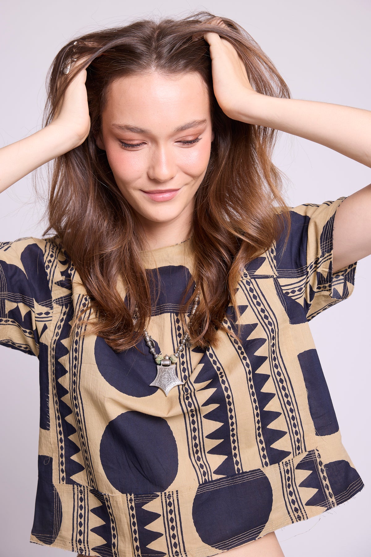 Close-up of top KLEED Kaner Midnight Geo Pyjama — 100% cotton with bold navy geometric and tribal stripe print