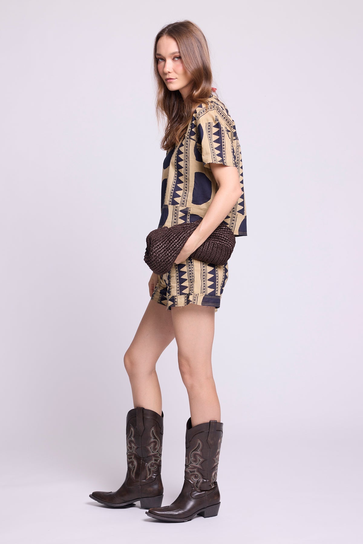 Side view of KLEED Kaner Midnight Geo Pyjama — sustainable cotton set with oversized navy circle and tribal stripe print