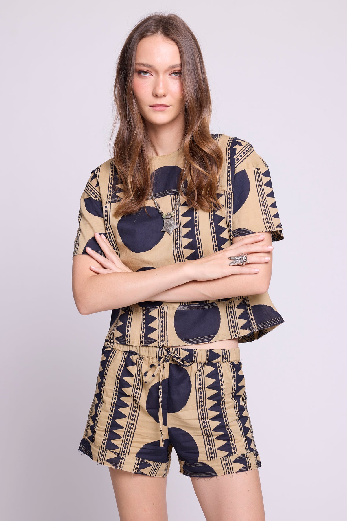 Close-up of KLEED Kaner Midnight Geo Pyjama — 100% cotton with bold navy geometric and tribal stripe print