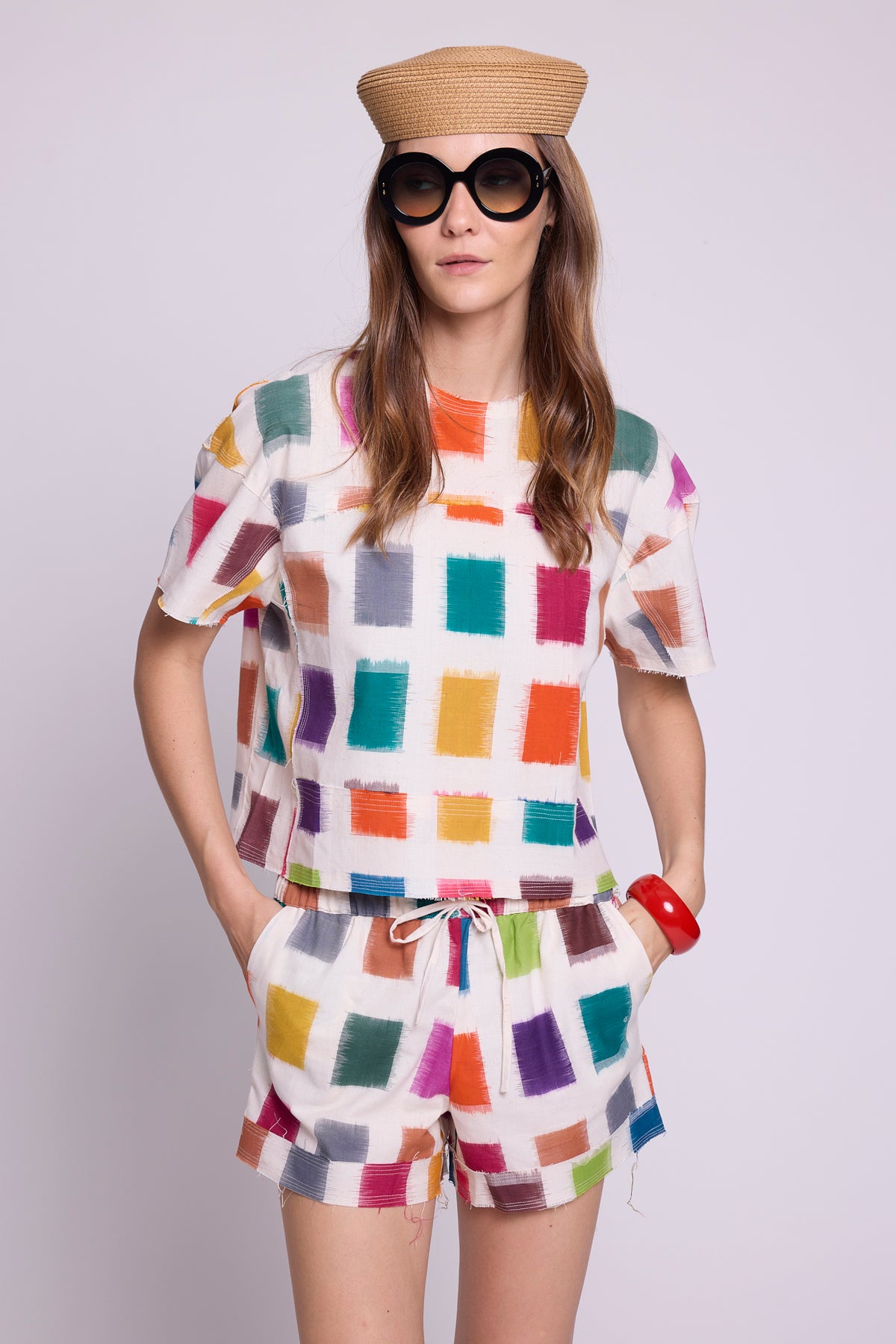 Close-up of KLEED Kaner Multisquares Pyjama — handloomed ikat cotton fabric with multicoloured squares