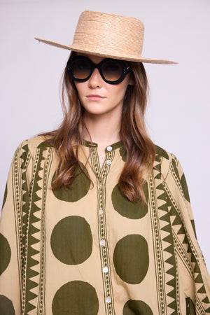 Model wearing the KLEED Khaki Geo Balloon Shirt in 100% cotton, close-up showing the khaki and sand geometric print and balloon sleeves.