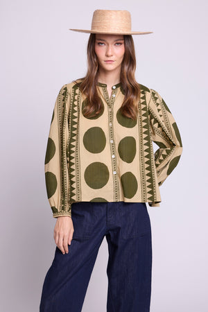 Model wearing the KLEED Khaki Geo Balloon Shirt in 100% cotton, front view showing the geometric print and relaxed silhouette.
