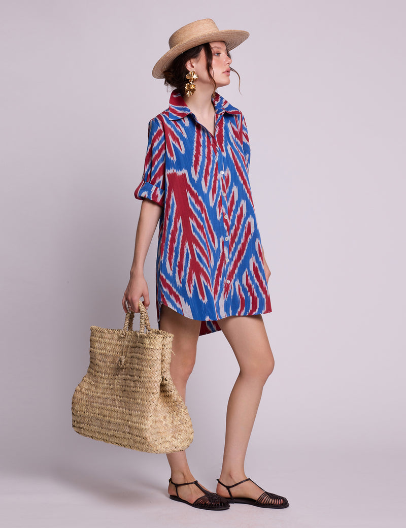 Woman wearing KLEED Madu Scarlett Leaves Chemisier, handloomed ikat cotton, sustainable luxury resortwear