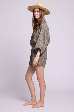 Side view of Mogra Hara Pyjama by KLEED — hand block printed 100% cotton oversized shirt and shorts in sage green floral