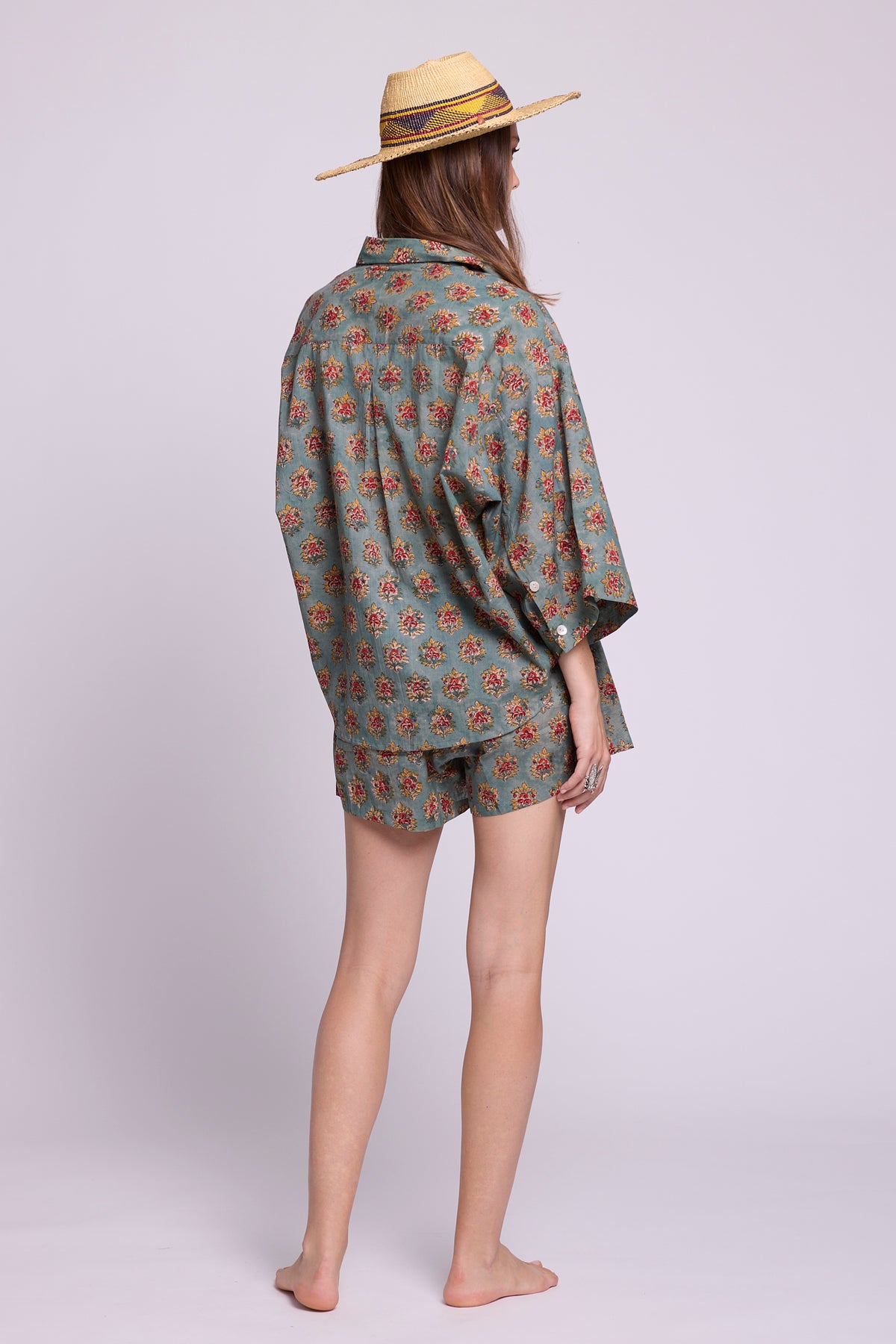  Back view of Mogra Hara Pyjama by KLEED — hand block printed 100% cotton oversized shirt and shorts in sage green floralBack view of Mogra Hara Pyjama by KLEED — hand block printed 100% cotton oversized shirt and shorts in sage green flora