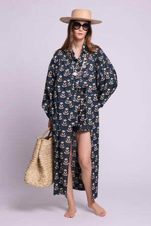 Model wearing mogra krisant pyjama and mogra naya kimono by kleed. 100% hand blockprinted cotton. Model wear straw hat, a basket and black  sun glasses.