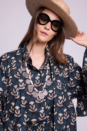 close up of model wearing mogra krisant pyjama, by kleed. 100% artisanal cotton, day pyjama, matching krisant naya kimono. Quiet luxury loungewear.