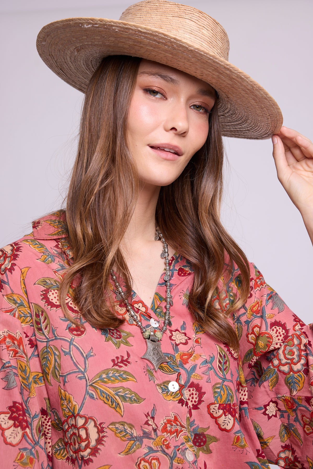 Close-up of Mogra Pink Pyjama by KLEED — hand block printed 100% cotton fabric detail in pink with multicolour floral print