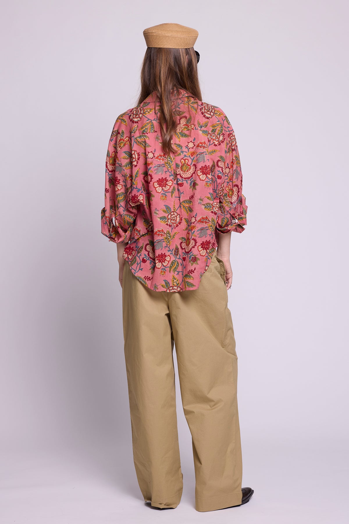 Back view of Mogra Pink Pyjama top by KLEED — hand block printed 100% cotton oversized shirt in pink floral, styled with wide leg trousers