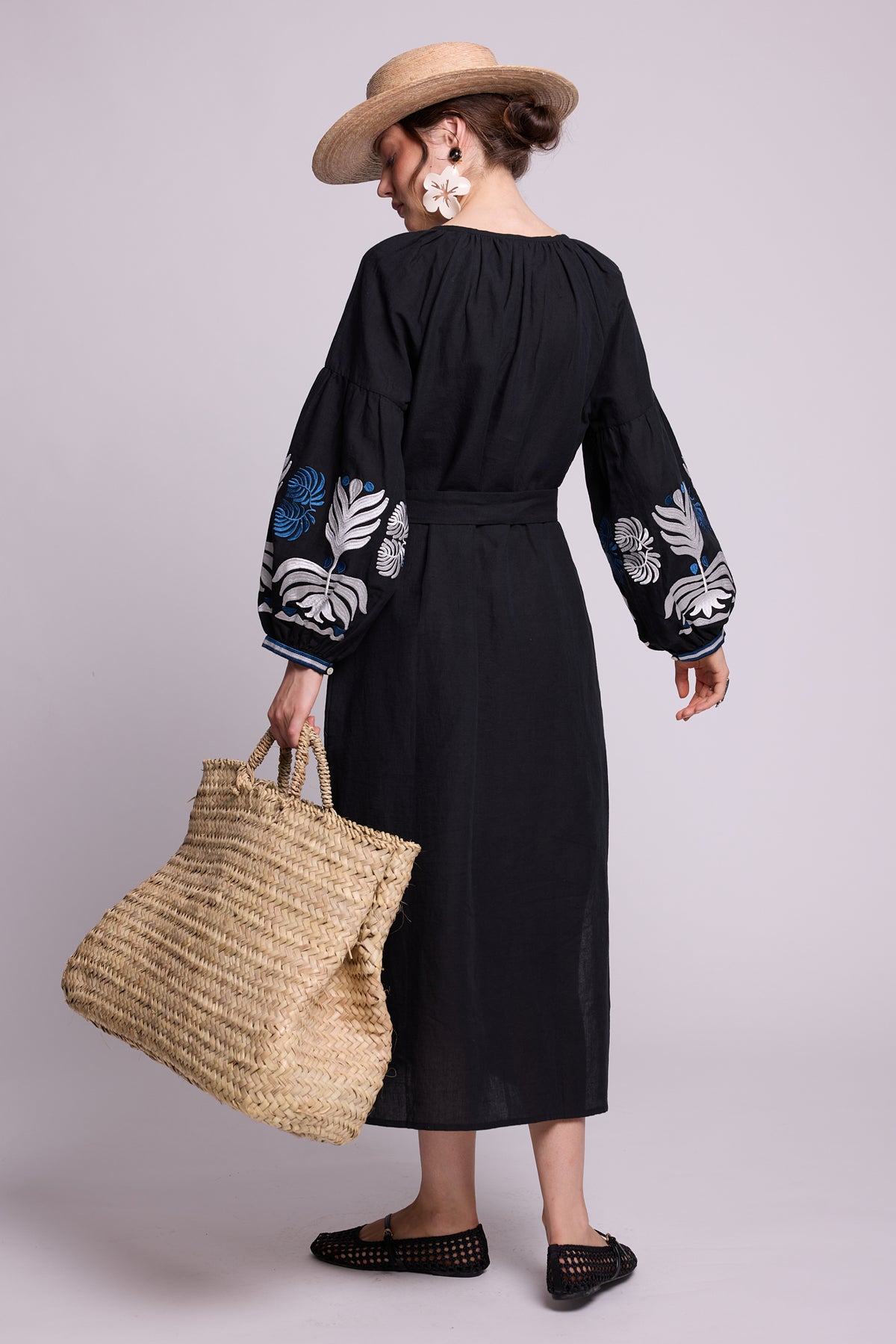 Back view of model wearing the KLEED Portofino Black Kaftan, showing its relaxed long silhouette and embroidered sleeves.
